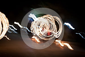 Amazing fire show dance. Fire dancer playing with flame