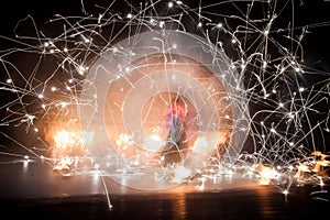 Amazing fire show dance. Fire dancers in beautiful costumes playing with colorful flames