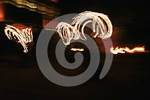 Amazing fire show at night at festival or wedding party. Fire da