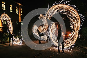 Amazing fire show at night at festival or wedding party. Fire da