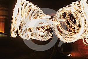 Amazing fire show at night at festival or wedding party. Fire da