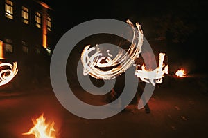 Amazing fire show at night at festival or wedding party. Fire da