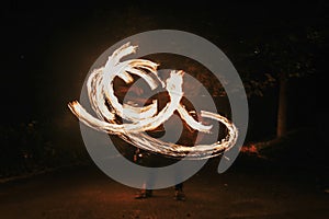 Amazing fire show at night at festival or wedding party. Fire da