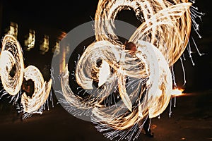 Amazing fire show at night at festival or wedding party. Fire da