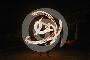 Amazing fire show at night at festival or wedding party. Fire da