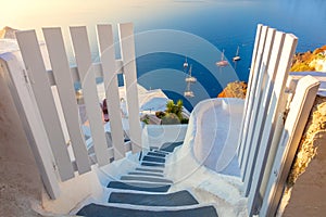 Amazing Gate to heaven. Santorini, Greece. White architecture, open doors and steps to the blue sea of Santorini