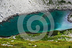 amazing green blue lake like the caribian sea in  the mountains close up photo