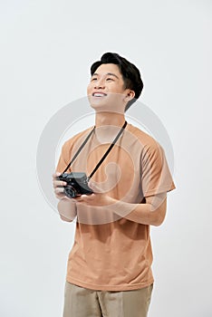 Amazing guy with photo digicam in hands wear casual t-shirt isolated on white background