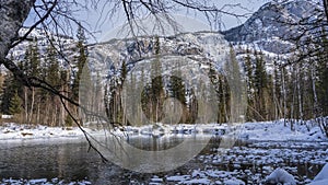 The amazing ice-free lake is surrounded by mountains.