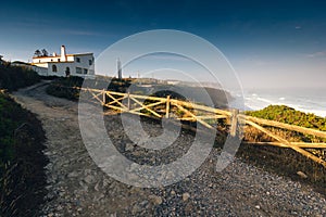 Amazing landscape on the Atlantic ocean at morning. View of the steep slopes of the rocky coast and the foam waves of the ocean. B