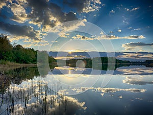 Amazing landscape background with lake and sky in the summer season