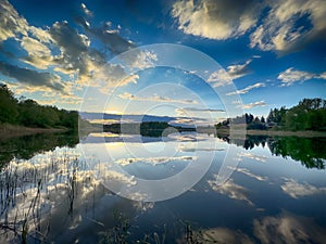 Amazing landscape background with lake and sky in the summer season