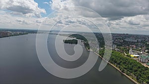 Amazing landscape of beautiful river dividing city on two parts on summer day