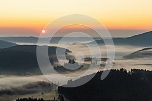 Amazing landscape of the Black Forest in the morning with fog during sunrise, seen from a hot-air ballon, Hinterzarten