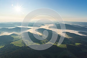 Amazing landscape of the Black Forest in the morning with fog during sunrise, seen from a hot-air ballon, Hinterzarten