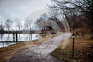 Amazing landscape of bridge reflect on surface water of lake, fog evaporate from pond make romantic scene or Beautiful bridge on l