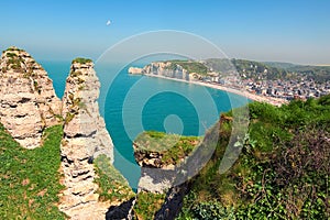 Amazing landscape on the cliff, city of Etretat and the English Channel in sunny spring day. Etretat, Seine-Maritime department, N