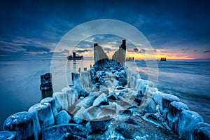 Amazing landscape of frozen beach of baltic Sea in Babie Doly at sunrise. Gdynia, Poland