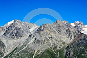 Amazing landscape of rocky mountains and blue sky, Caucasus, Russia