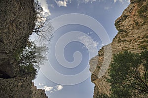 amazing landscape of rocky mountains and blue sky . Sky view between two rocks. Big Caucasus mountains