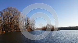 Amazing landscape seen from the kayak. forest reflecting in the lake water. extreme sports combined with relaxation during the aut