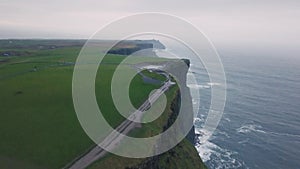 Amazing landscape view of beautiful cliffs of moher taking video with drone from the high top.