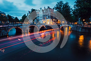 Amazing Light trails and reflections on water at the Leidsegracht and Keizersgracht canals in Amsterdam at evening. Long
