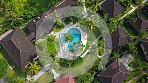 Amazing Luxury resort in Indonesia. Drone View of large villa with massive beautiful pool tucked within lush greenery and perched