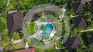 Amazing Luxury resort in Indonesia. Drone View of large villa with massive beautiful pool tucked within lush greenery and perched