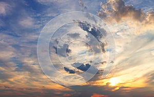 Amazing mix of colors in the sky and placing clouds during sunset. Sky background