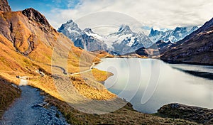 Amazing morning view of Bachalp lake / Bachalpsee, Switzerland. Nice autumn scene of Swiss alps, Grindelwald, Bernese Oberland, Eu