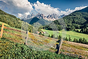 Amazing morning view of St. Magdalena village. Green summer scene of Funes Valley Villnob with Odle Group mountains on backgroun