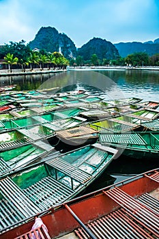 Amazing morning view with Vietnamese boats at river, Tam Coc, Ninh Binh, Vietnam travel landscape and destinations