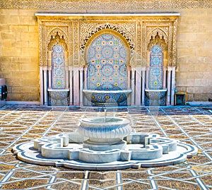Amazing moroccan style fountain with fine colorful mosaic tiles at the Mohammed V mausoleum in Rabat Morocco. Artistic picture.