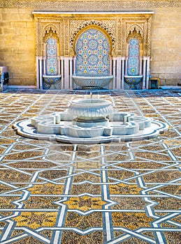 Amazing moroccan style fountain with fine colorful mosaic tiles at the Mohammed V mausoleum in Rabat Morocco. Artistic picture.