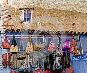 Amazing Morocco, blue city of Chefchaouen, narrow streets, unusual bags for sale