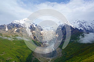 Amazing mountain Caucasus landscape of peaks of mountains Tetnuldi, Gistola and Dzhangi-Tau and glacier Lardaad in Svaneti, Georgi