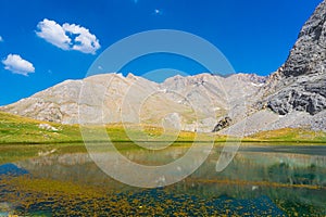 Amazing mountain lake landscape between Bolkar Mountain and Taurus Mountain. Panoramic view of black lake at sunset. Nigde, Turkey photo