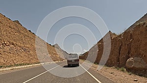 Amazing mountain landscape. Beautiful mountain valley. The minivan is driving through a picturesque gorge.