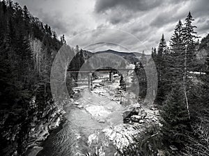 Amazing mountain landscape with bridge over the river