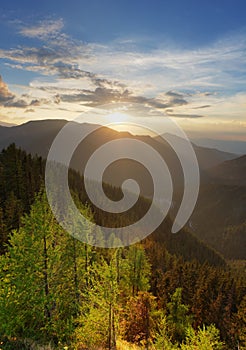 Amazing mountain landscape with colorful vivid sunset on the cloudy sky, natural outdoor travel background