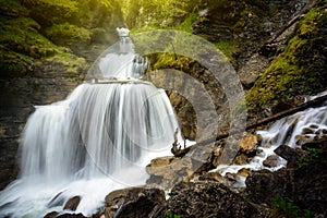 Amazing mountain waterfall near Farchant village at Garmisch Partenkirchen, Farchant, Bavaria, Germany. photo