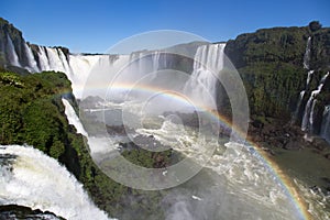 Amazing National Park of Iguazu Falls with a full rainbow over the water, Foz do IguaÃ§u, Brazil