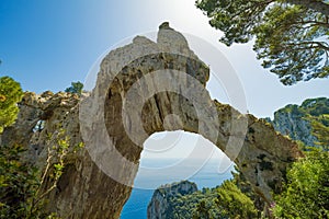 Arco Naturale, natural arch on coast of Capri island, Italy photo