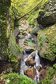 Amazing nature landscape of Tolmin Gorge Tolminska Korita. Fast mountain river flows between the high mountains.