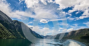 Amazing nature view with beautiful clouds above the fjord. Location: Lysefjorden, Norway, Europe. Artistic picture. Beauty world.