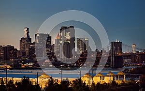 Amazing New York City Manhattan skyline panorama view over Hudson River at dusk. Brooklyn bridge