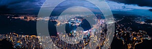 Amazing night aerial view of cityscape of Victoria Harbour, center of Hong Kong