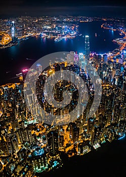 Amazing night aerial view of cityscape of Victoria Harbour, center of Hong Kong