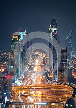 Amazing night dubai downtown skyline and road leading to Abu Dhabi, Dubai, United Arab Emirates